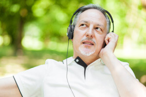 Man listening music in a park