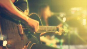 Guitarist on stage for background, soft and blur concept, Vintage color tone style